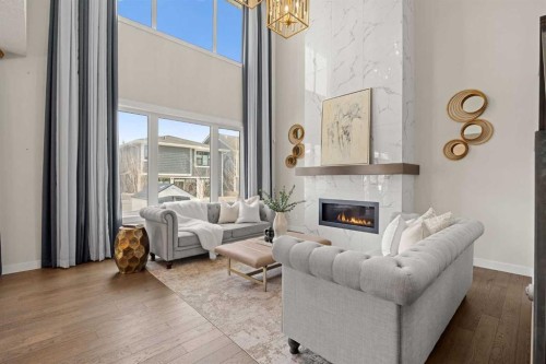 225 West Grove Way Sw, Calgary, AB - Indoor Photo Showing Living Room With Fireplace