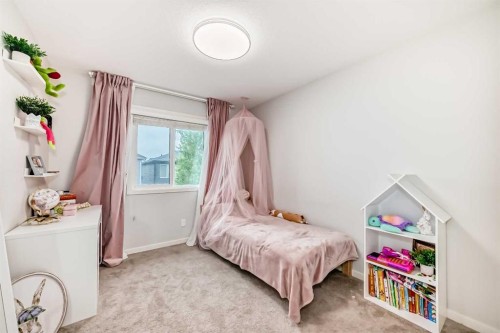 54 Seton Manor Se, Calgary, AB - Indoor Photo Showing Bedroom
