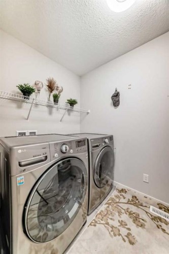54 Seton Manor Se, Calgary, AB - Indoor Photo Showing Laundry Room