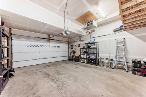 54 Seton Manor Se, Calgary, AB - Indoor Photo Showing Garage