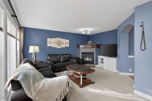 169 West Creek Boulevard, Chestermere, AB - Indoor Photo Showing Living Room With Fireplace