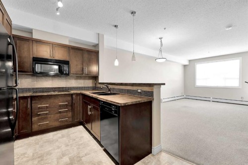 318-26 Val Gardena View Sw, Calgary, AB - Indoor Photo Showing Kitchen