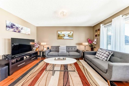 69 Applemont Place Se, Calgary, AB - Indoor Photo Showing Living Room