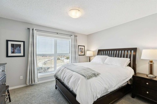 1119 Livingston Way Ne, Calgary, AB - Indoor Photo Showing Bedroom