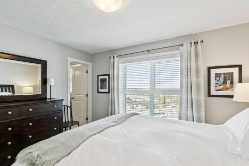 1119 Livingston Way Ne, Calgary, AB - Indoor Photo Showing Bedroom