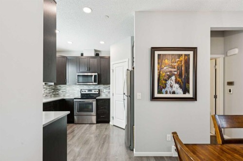 1119 Livingston Way Ne, Calgary, AB - Indoor Photo Showing Kitchen With Upgraded Kitchen