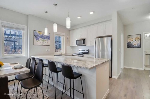 103-30 Mahogany Mews Se, Calgary, AB - Indoor Photo Showing Kitchen With Stainless Steel Kitchen With Upgraded Kitchen