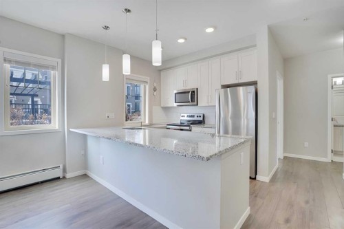 103-30 Mahogany Mews Se, Calgary, AB - Indoor Photo Showing Kitchen With Stainless Steel Kitchen With Upgraded Kitchen