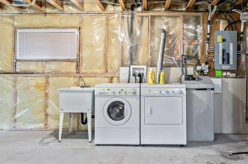265 Somerside Park Sw, Calgary, AB - Indoor Photo Showing Laundry Room