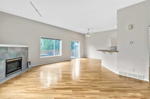 265 Somerside Park Sw, Calgary, AB - Indoor Photo Showing Other Room With Fireplace