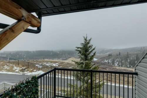 1502 Jumping Pound Common, Cochrane, AB - Outdoor With View With Exterior