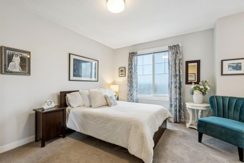 1502 Jumping Pound Common, Cochrane, AB - Indoor Photo Showing Bedroom