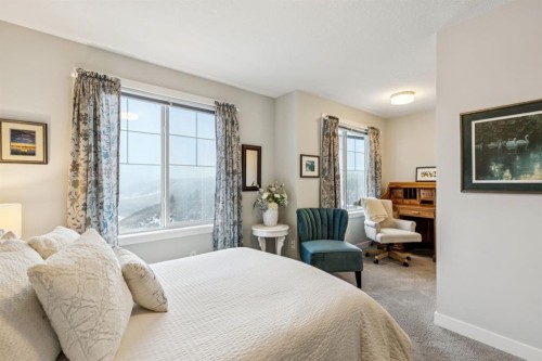 1502 Jumping Pound Common, Cochrane, AB - Indoor Photo Showing Bedroom