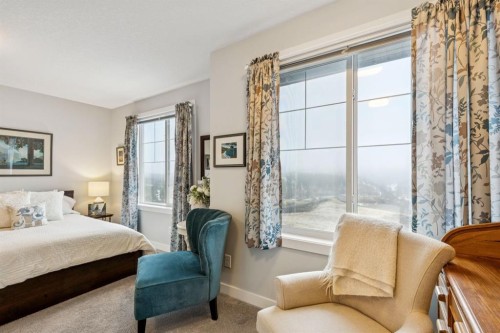 1502 Jumping Pound Common, Cochrane, AB - Indoor Photo Showing Bedroom