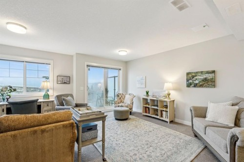 1502 Jumping Pound Common, Cochrane, AB - Indoor Photo Showing Living Room
