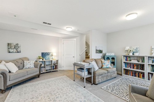 1502 Jumping Pound Common, Cochrane, AB - Indoor Photo Showing Living Room