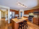 101 Westpoint Gardens, Calgary, AB  - Indoor Photo Showing Kitchen With Stainless Steel Kitchen With Double Sink 