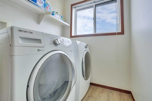 83 Bridlecreek Heath Sw, Calgary, AB - Indoor Photo Showing Laundry Room