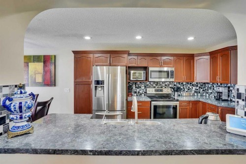 83 Bridlecreek Heath Sw, Calgary, AB - Indoor Photo Showing Kitchen With Double Sink