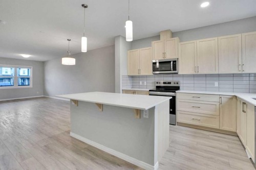 667 Wolf Willow Boulevard Se, Calgary, AB - Indoor Photo Showing Kitchen With Upgraded Kitchen