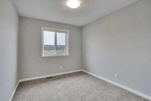 667 Wolf Willow Boulevard Se, Calgary, AB - Indoor Photo Showing Other Room