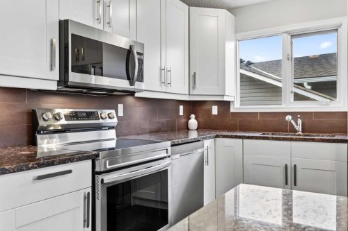 111 Sanderling Rise Nw, Calgary, AB - Indoor Photo Showing Kitchen With Stainless Steel Kitchen With Double Sink With Upgraded Kitchen