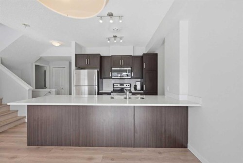 413-250 Fireside View, Cochrane, AB - Indoor Photo Showing Kitchen