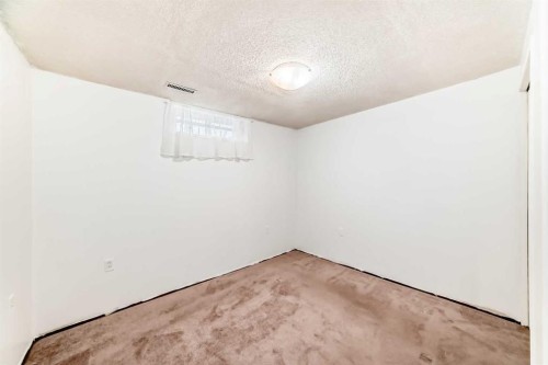 130 Pinemeadow Road Ne, Calgary, AB - Indoor Photo Showing Other Room