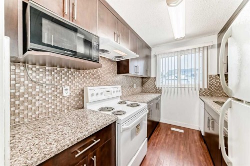 130 Pinemeadow Road Ne, Calgary, AB - Indoor Photo Showing Kitchen