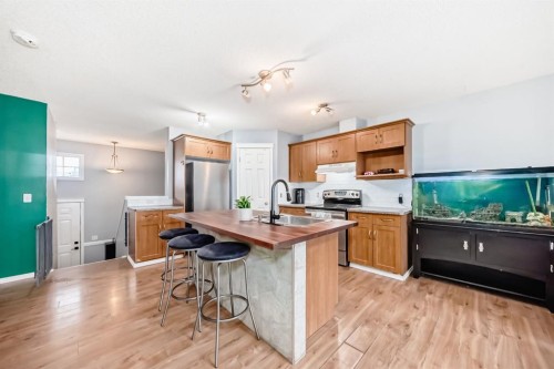 213 Hillvale Crescent, Strathmore, AB - Indoor Photo Showing Kitchen With Double Sink