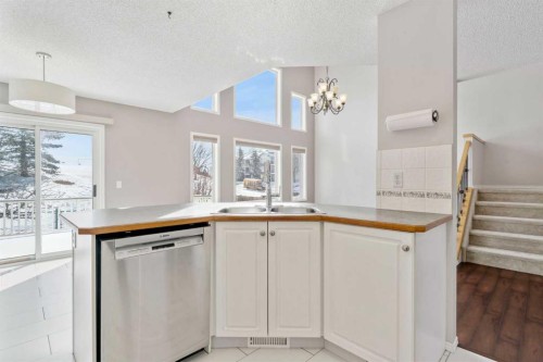 10 Arbour Stone Rise Nw, Calgary, AB - Indoor Photo Showing Kitchen With Double Sink