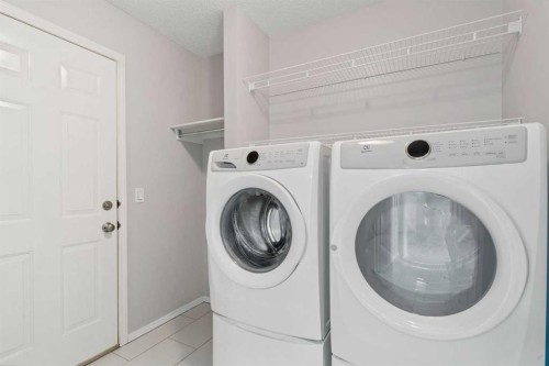 10 Arbour Stone Rise Nw, Calgary, AB - Indoor Photo Showing Laundry Room