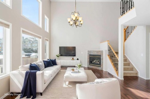 10 Arbour Stone Rise Nw, Calgary, AB - Indoor Photo Showing Living Room With Fireplace