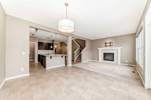 144 Auburn Glen Close Se, Calgary, AB - Indoor Photo Showing Living Room With Fireplace