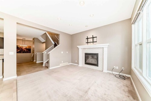 144 Auburn Glen Close Se, Calgary, AB - Indoor Photo Showing Living Room With Fireplace