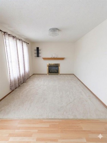 746 Martindale Boulevard Ne, Calgary, AB - Indoor With Fireplace
