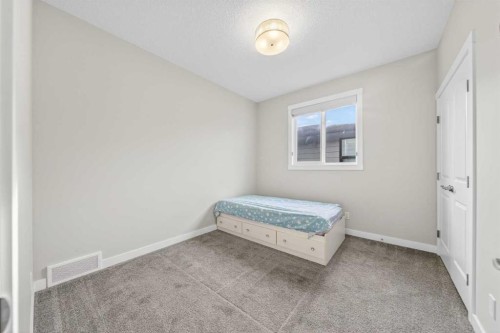 234 West Grove Point Sw, Calgary, AB - Indoor Photo Showing Bedroom