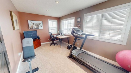 158 Ranch Road, Okotoks, AB - Indoor Photo Showing Gym Room