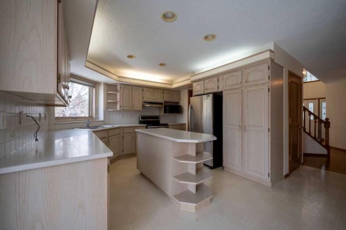 207 Shawnee Mews Sw, Calgary, AB - Indoor Photo Showing Kitchen With Double Sink