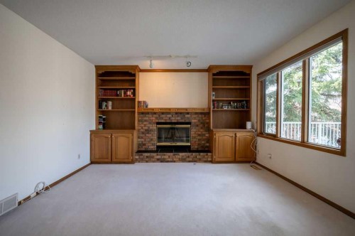 207 Shawnee Mews Sw, Calgary, AB - Indoor With Fireplace