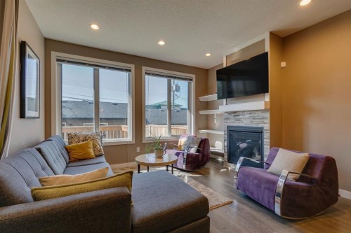 2817 16 Avenue Se, Calgary, AB - Indoor Photo Showing Living Room With Fireplace