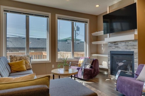 2817 16 Avenue Se, Calgary, AB - Indoor Photo Showing Living Room With Fireplace