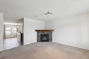200 Silverado Drive Sw, Calgary, AB  - Indoor Photo Showing Living Room With Fireplace 