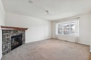 200 Silverado Drive Sw, Calgary, AB  - Indoor Photo Showing Living Room With Fireplace 