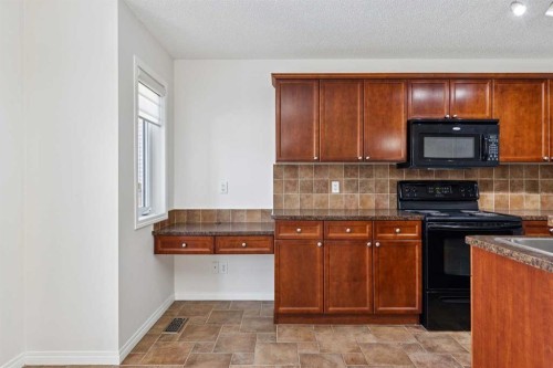 200 Silverado Drive Sw, Calgary, AB - Indoor Photo Showing Kitchen
