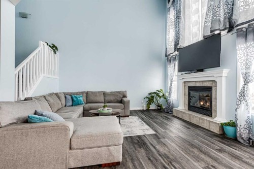94 New Brighton Circle Se, Calgary, AB - Indoor Photo Showing Living Room With Fireplace