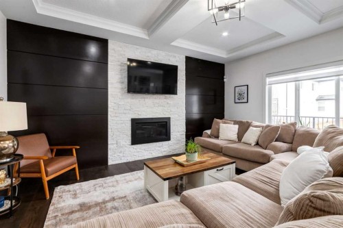 305 Kinniburgh Cove, Chestermere, AB - Indoor Photo Showing Living Room With Fireplace