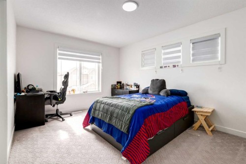 305 Kinniburgh Cove, Chestermere, AB - Indoor Photo Showing Bedroom
