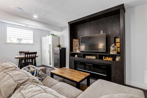 305 Kinniburgh Cove, Chestermere, AB - Indoor With Fireplace
