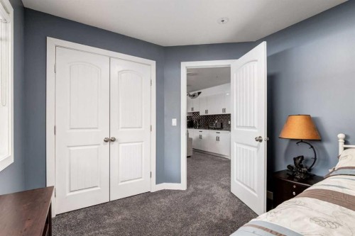305 Kinniburgh Cove, Chestermere, AB - Indoor Photo Showing Bedroom